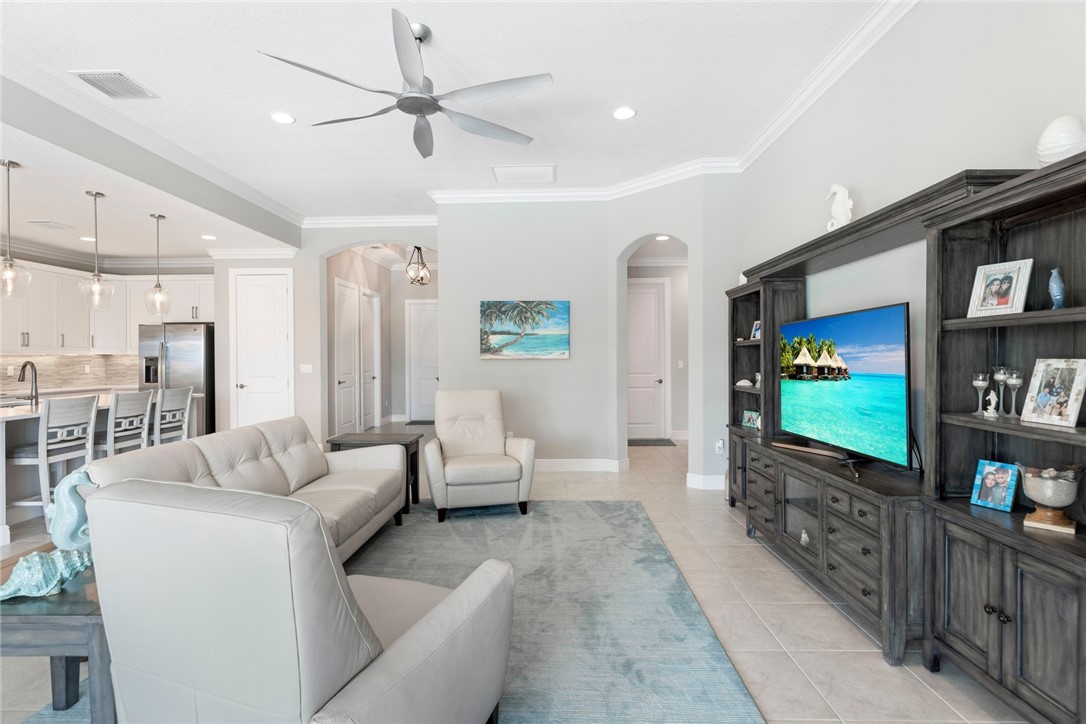 7203 33rd Square Vero Beach, FL 32967 - Photo 8 of 28 a living room with furniture and a flat screen tv