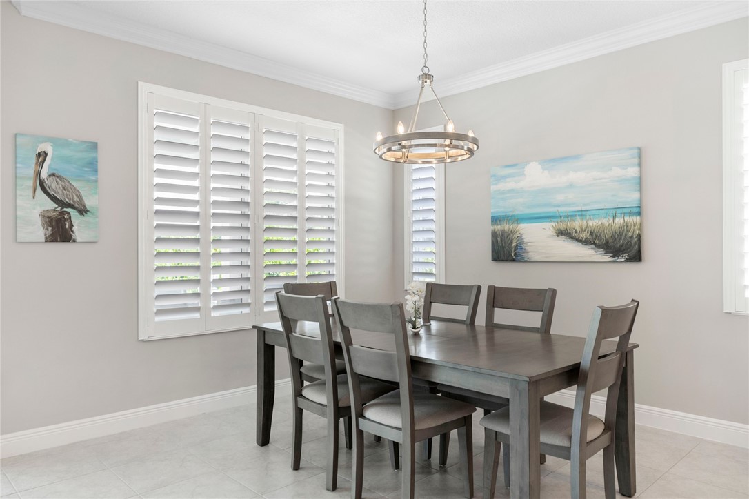 7203 33rd Square Vero Beach, FL 32967 - Photo 9 of 28 a view of a dining room with furniture window and outside view