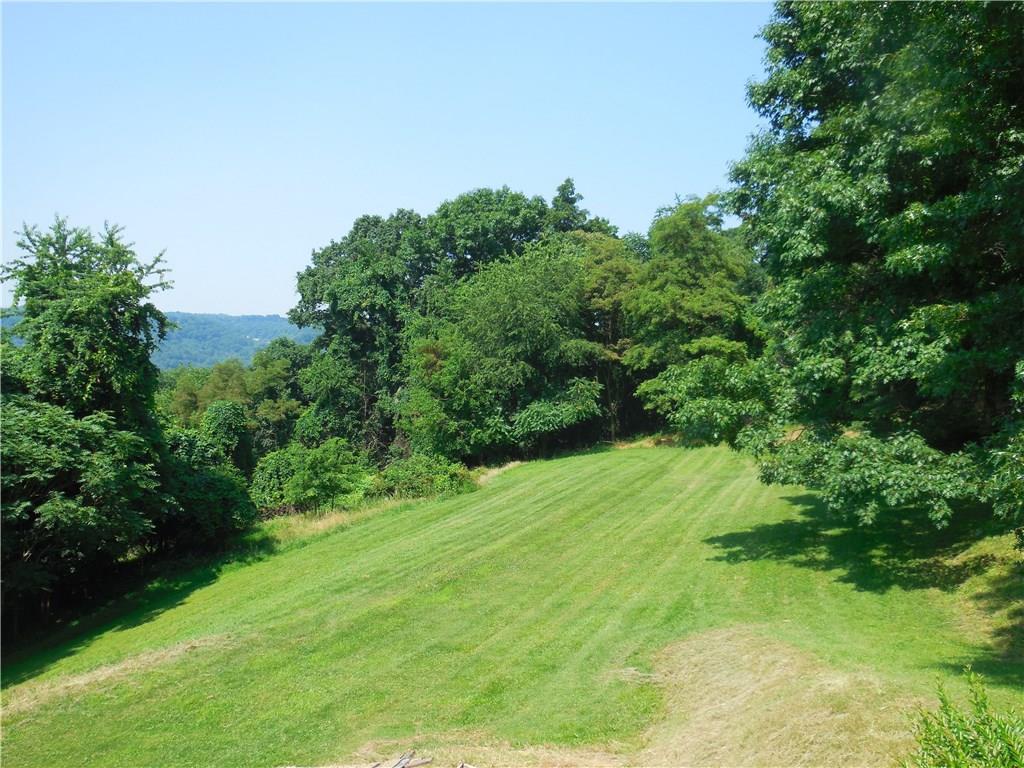 609 Sycamore Rd Extension Sewickley, PA 15143 - Photo 3 of 21 Beautiful view of the side yard of property and adjoining acreage. Property extends into these woods making it perfect for additional new construction.