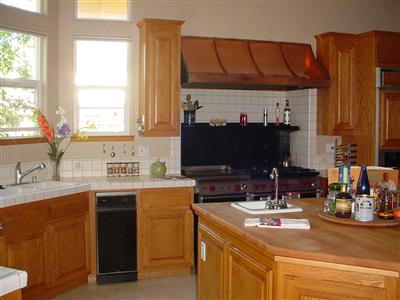 2036 Goldfield Lane Santa Rosa, CA 95403 - Photo 6 of 12 a kitchen with a sink and a stove top oven