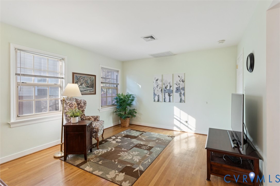 421 Scotland Street, Unit 3 Williamsburg, VA 23185 - Photo 11 of 26 a living room with furniture and a flat screen tv
