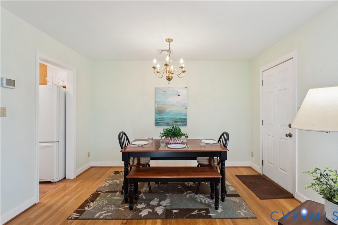 421 Scotland Street, Unit 3 Williamsburg, VA 23185 - Photo 13 of 26 a view of a dining room with furniture and wooden floor