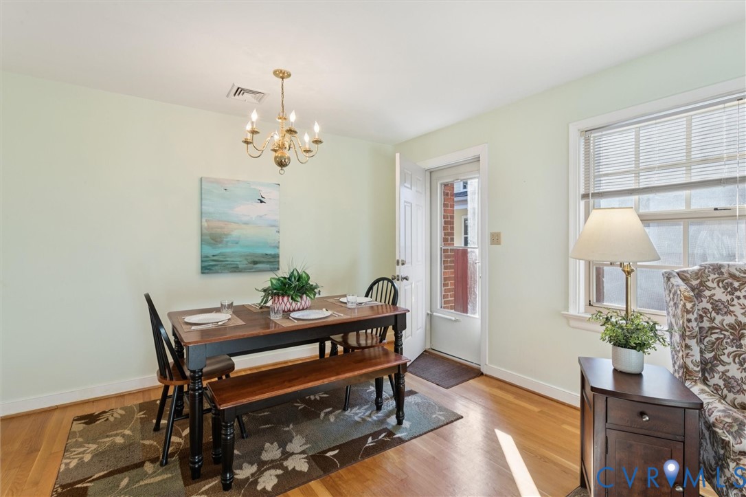 421 Scotland Street, Unit 3 Williamsburg, VA 23185 - Photo 14 of 26 a living room with furniture a table and a potted plant