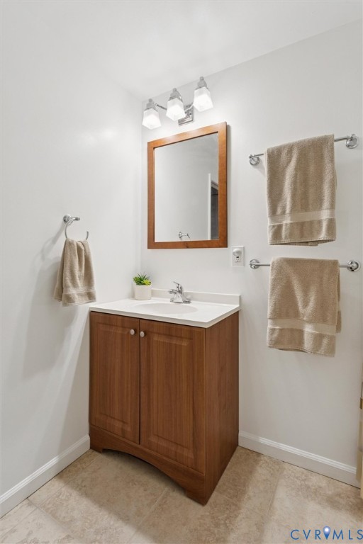 421 Scotland Street, Unit 3 Williamsburg, VA 23185 - Photo 22 of 26 a bathroom with a sink and a mirror