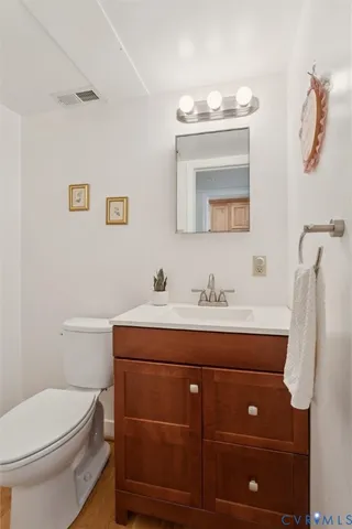 a kitchen with granite countertop a stove sink and microwave