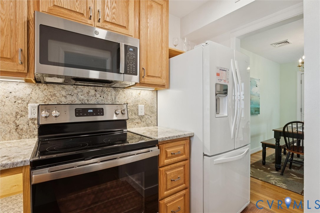 421 Scotland Street, Unit 3 Williamsburg, VA 23185 - Photo 9 of 26 a kitchen with stainless steel appliances a stove microwave and refrigerator