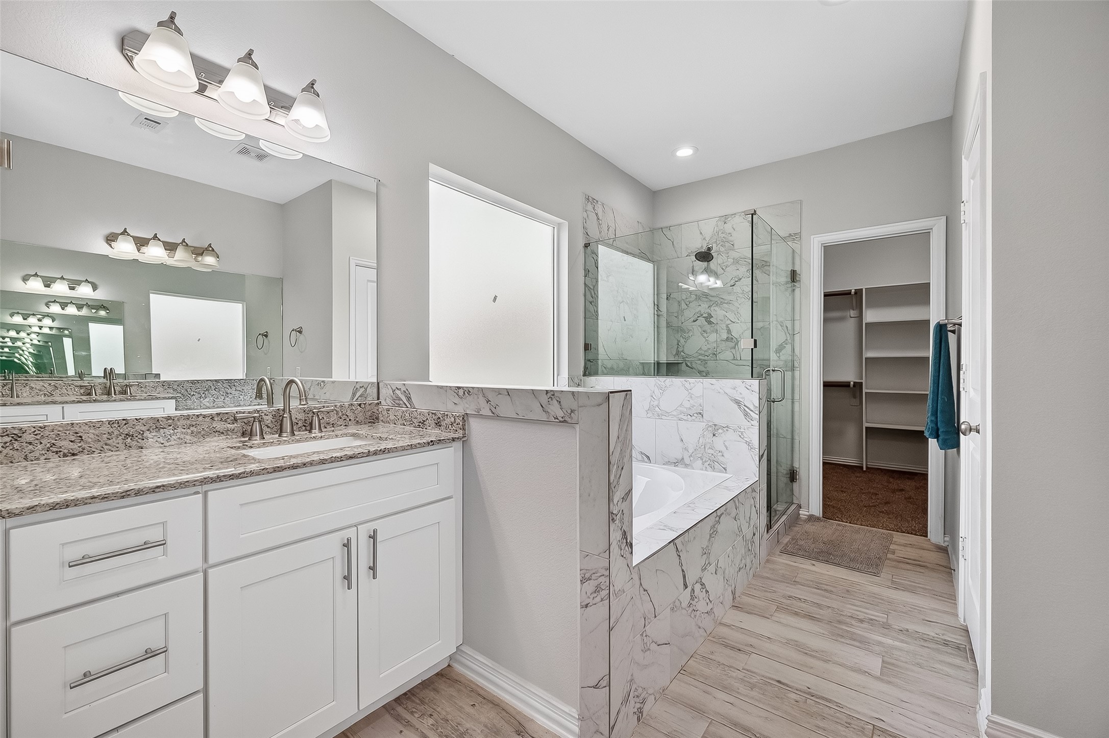 1411 Featherstone Street, Unit B Houston, TX 77020 - Photo 23 of 32 a bathroom with a double vanity sink and a mirror