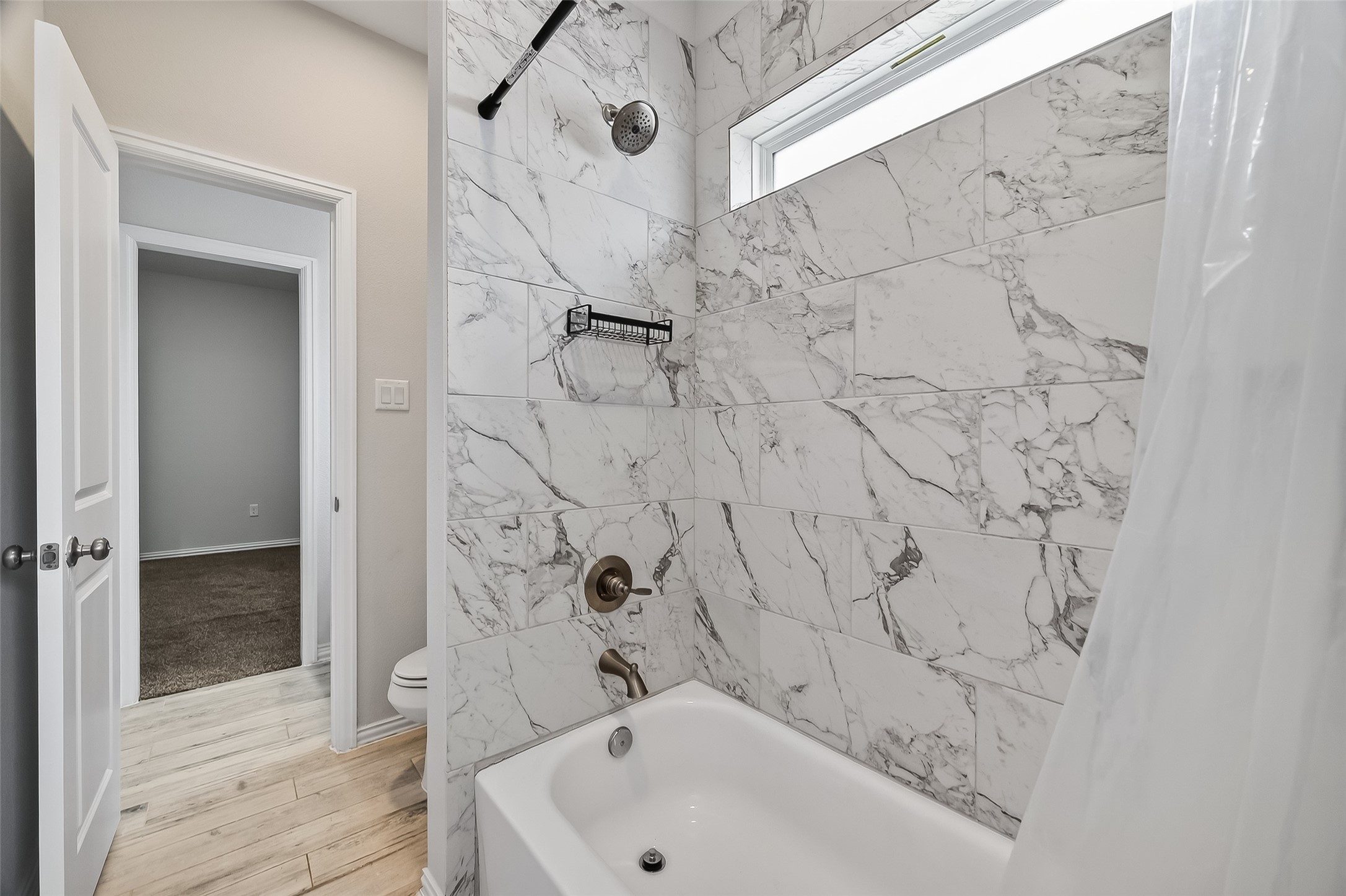 1411 Featherstone Street, Unit B Houston, TX 77020 - Photo 30 of 32 a bathroom with a bathtub and shower
