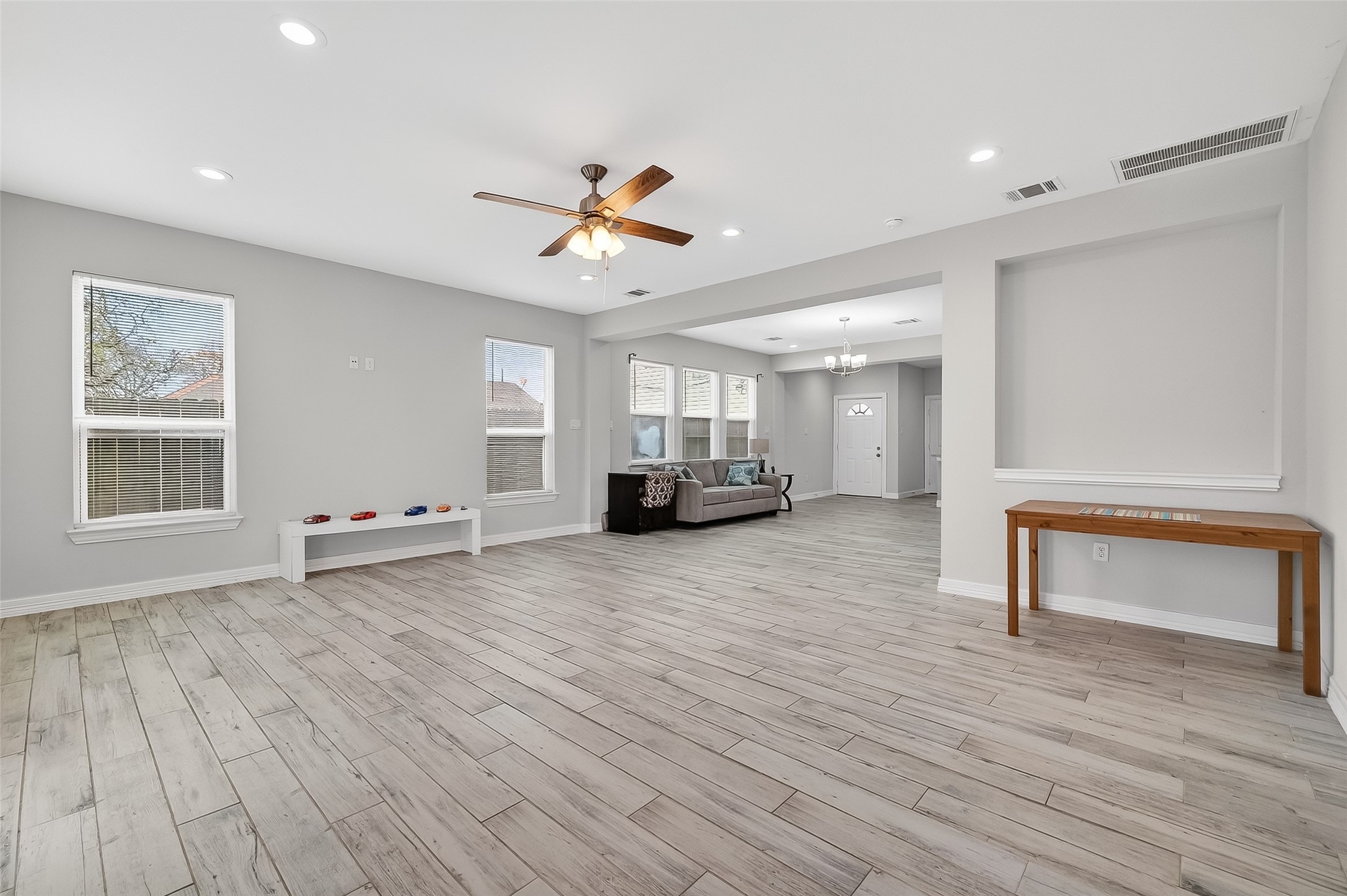1411 Featherstone Street, Unit B Houston, TX 77020 - Photo 6 of 32 a living room with furniture and a wooden floor