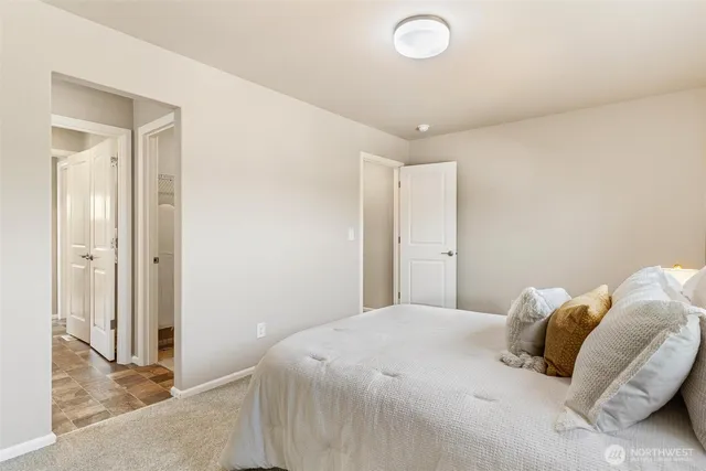 a bedroom with a bed and a granite counter tops