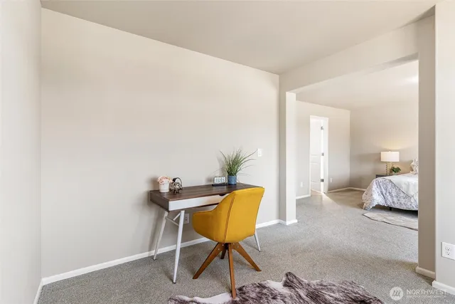 a living room with furniture and a lamp