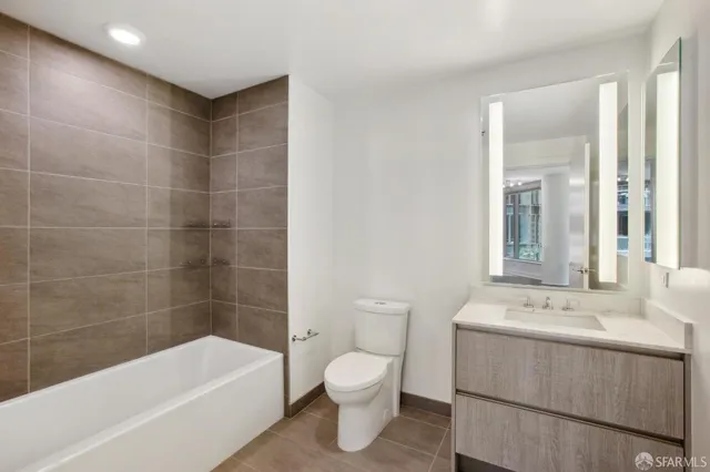 a bathroom with a sink a toilet and bathtub