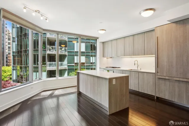 a kitchen with a stove a sink and a refrigerator