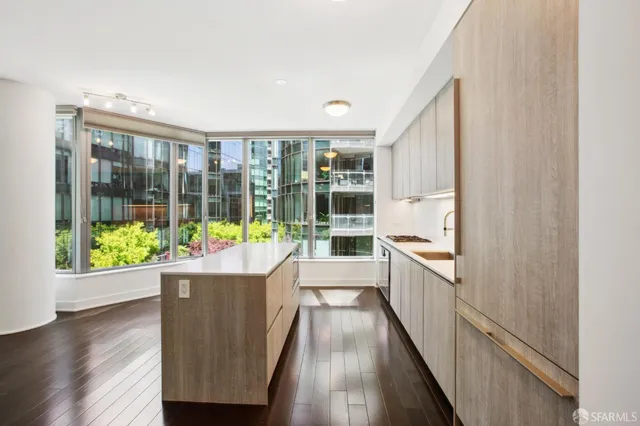 a living room with a couch and wooden floor