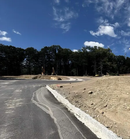 en suite bathroom with a bathtub and window