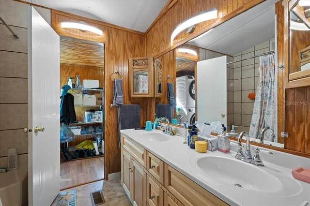 a bathroom with a sink and a mirror