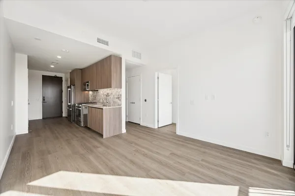a view of kitchen with wooden floor