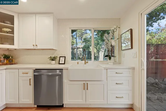 a view of hallway with wooden floor and stairs