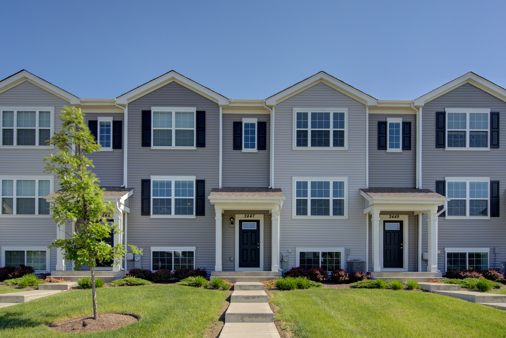 2447 Upland Road, Unit 2204 Pingree Grove, IL 60140 - Photo 1 of 1 a view of a yard in front of house