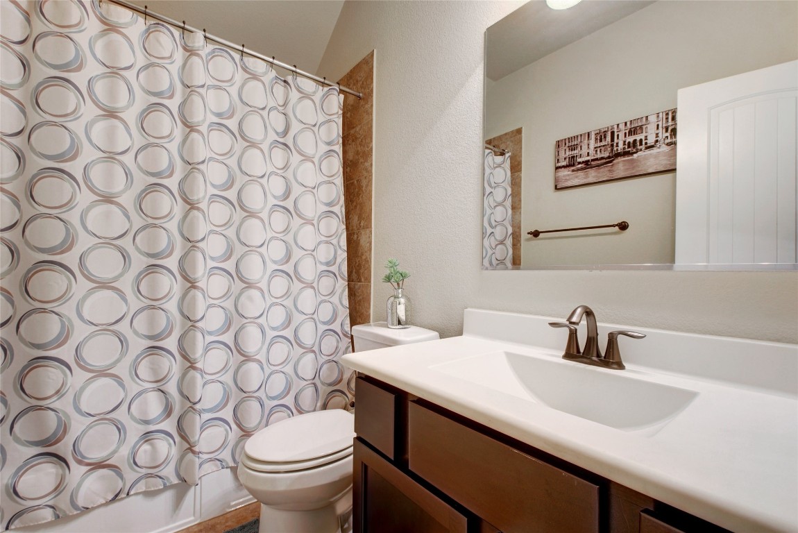 2004 Autumn Run Lane Round Rock, TX 78665 - Photo 19 of 35 a bathroom with a sink and a toilet