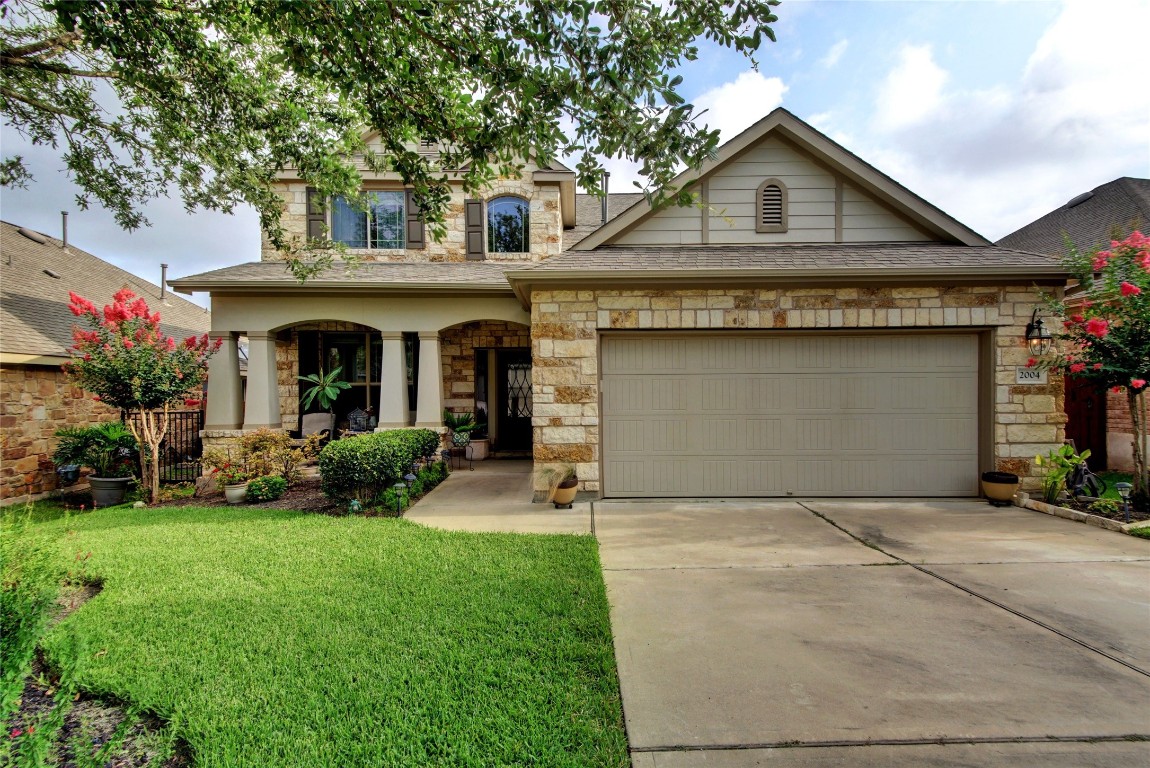 2004 Autumn Run Lane Round Rock, TX 78665 - Photo 2 of 35 a view of a house with garden and yard