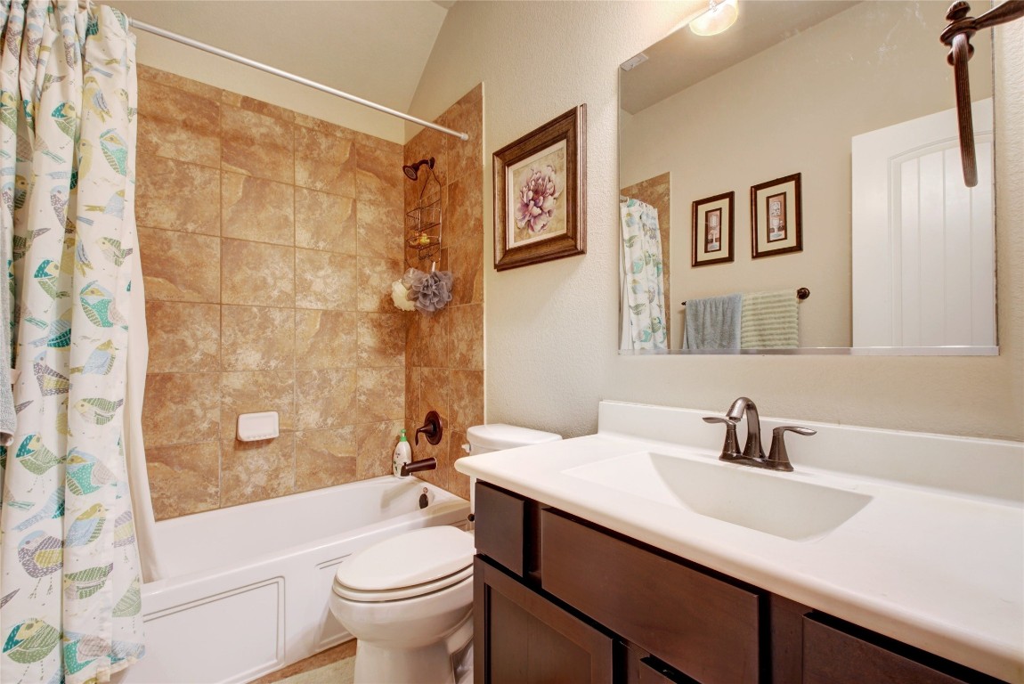 2004 Autumn Run Lane Round Rock, TX 78665 - Photo 21 of 35 a bathroom with a sink a toilet and shower