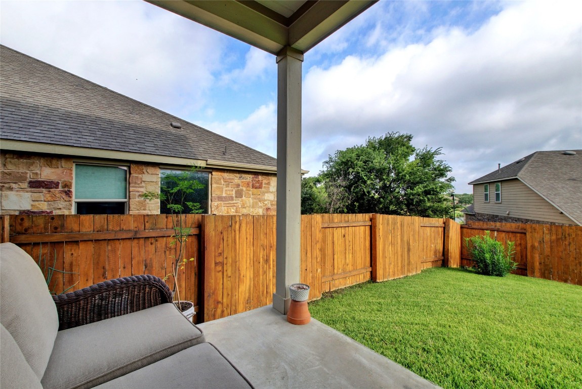2004 Autumn Run Lane Round Rock, TX 78665 - Photo 23 of 35 a view of a backyard with couches plants and wooden fence