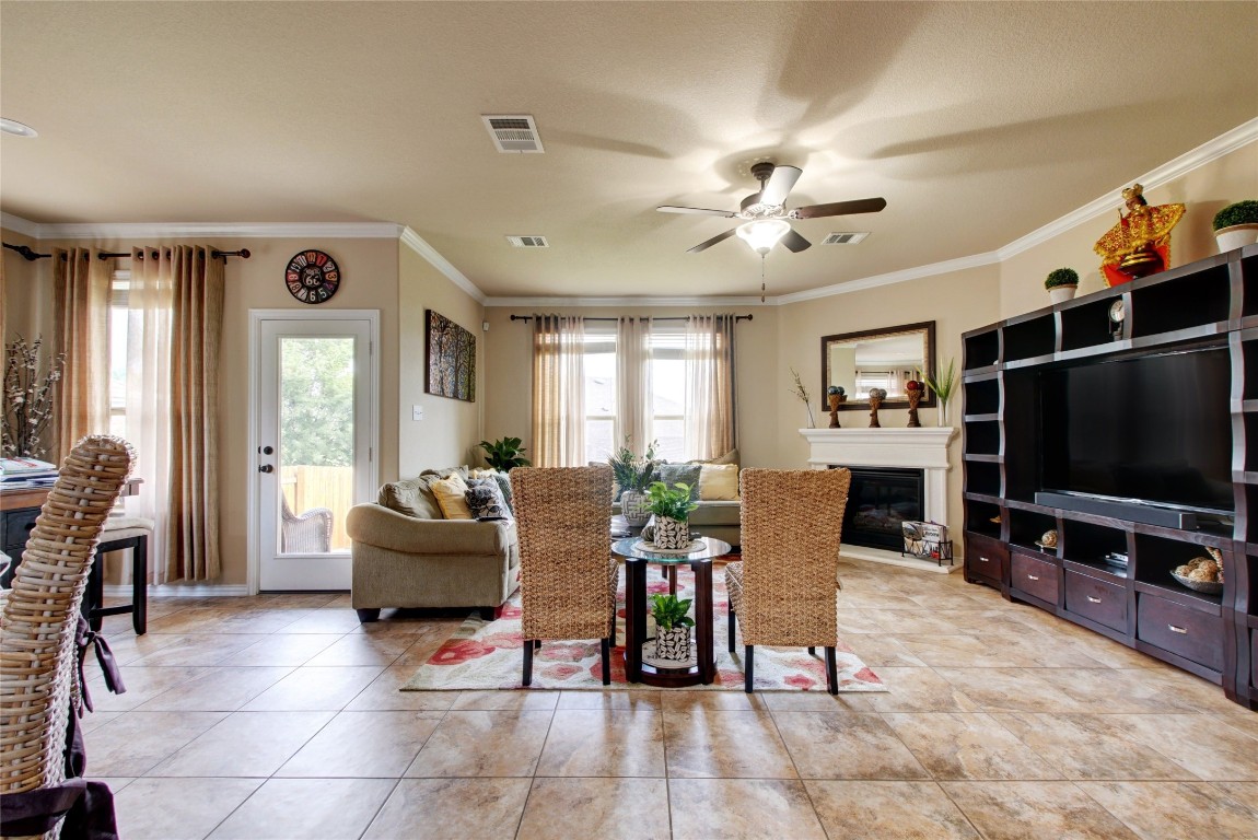 2004 Autumn Run Lane Round Rock, TX 78665 - Photo 4 of 35 a living room with furniture a flat screen tv and a window