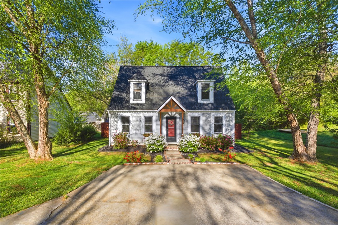 Charming home with lush landscaping and inviting curb appeal.