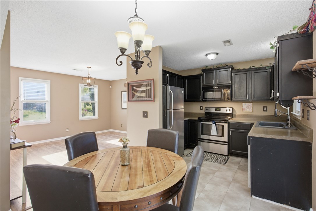 100 Henry Court Central, SC 29630 - Photo 11 of 39 This open concept kitchen and dining area provides seamless flow for daily living.
