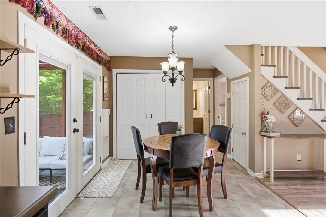 100 Henry Court Central, SC 29630 - Photo 12 of 39 This inviting dining area features ample natural light and seamless access to outdoor living.