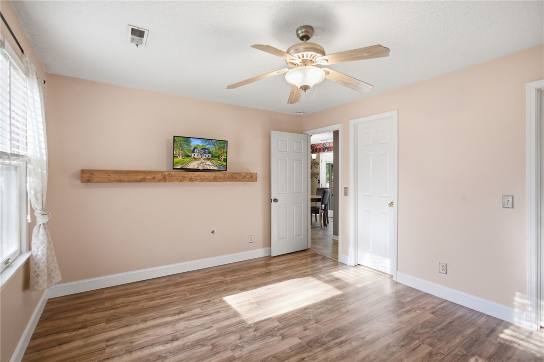 100 Henry Court Central, SC 29630 - Photo 15 of 39 This bright room features a practical ceiling fan, durable flooring, and ample natural light.