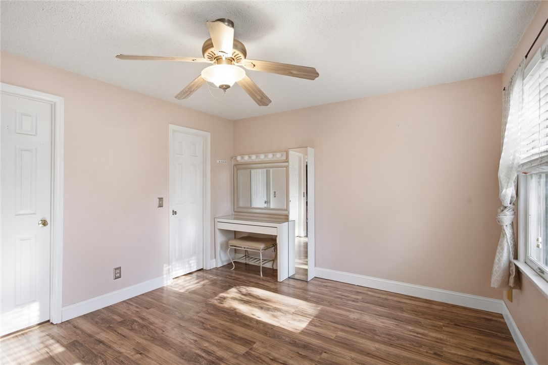 100 Henry Court Central, SC 29630 - Photo 16 of 39 This spacious bedroom offers ample natural light and a warm, inviting atmosphere.