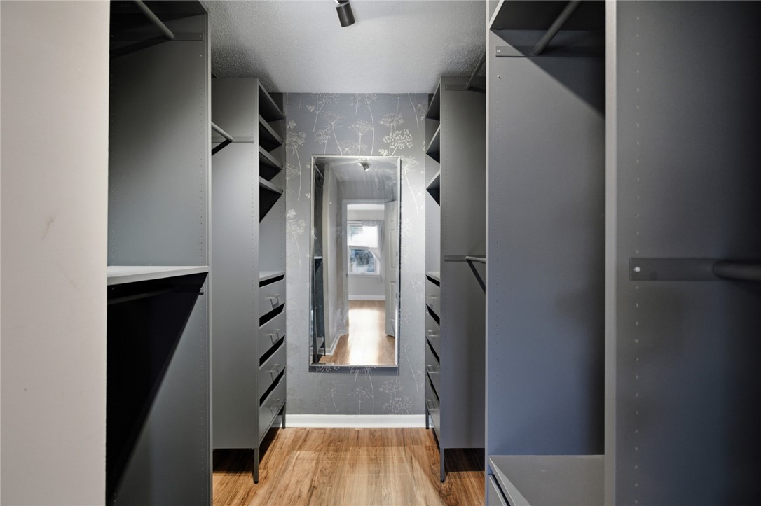 100 Henry Court Central, SC 29630 - Photo 19 of 39 This walk-in closet offers extensive shelving and hanging space, enhancing organization and daily routines.