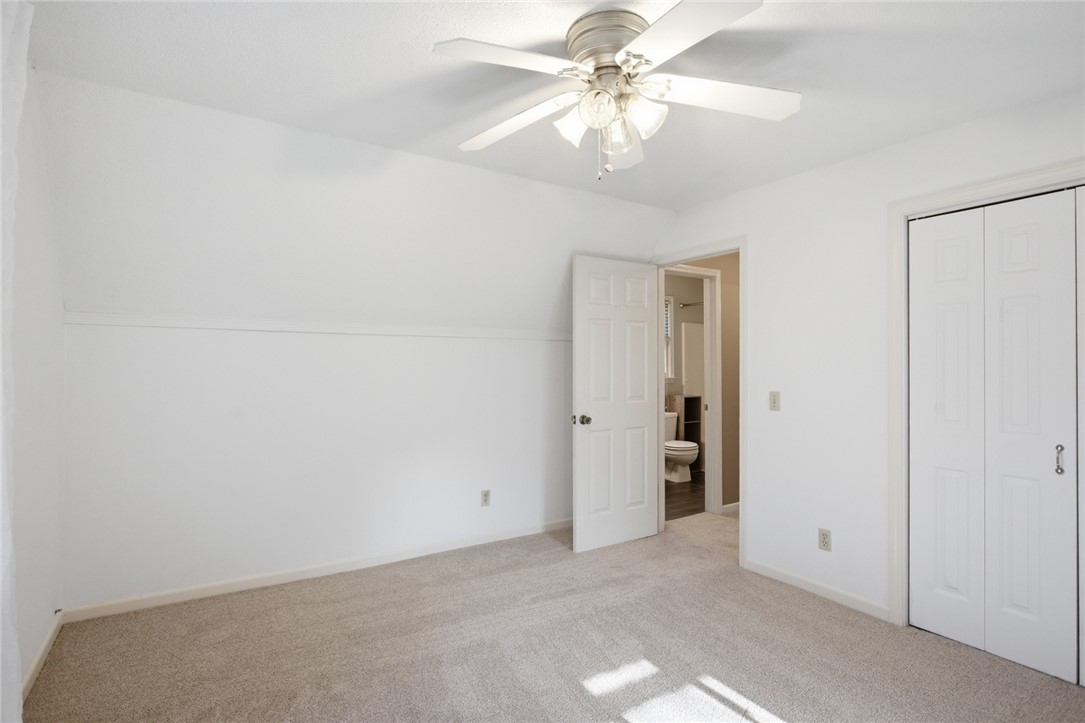 100 Henry Court Central, SC 29630 - Photo 21 of 39 This bright room features soft carpeting and convenient closet space, with an attached bath visible through the open doorway.