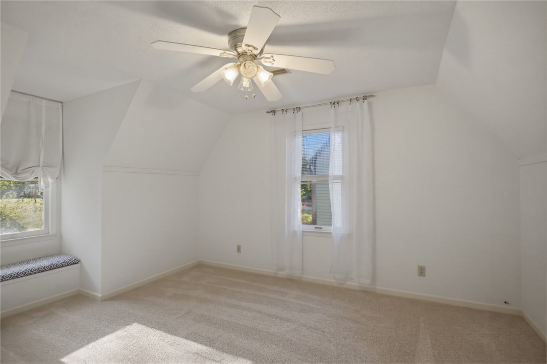 100 Henry Court Central, SC 29630 - Photo 22 of 39 This spacious bedroom offers ample natural light and a charming window seat, perfect for relaxation.