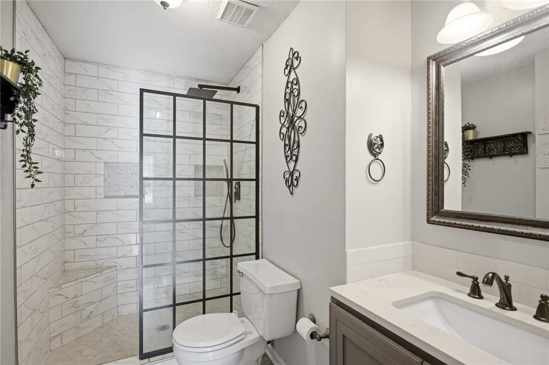 100 Henry Court Central, SC 29630 - Photo 26 of 39 This bathroom features a contemporary shower and a sleek vanity, offering a blend of style and utility.