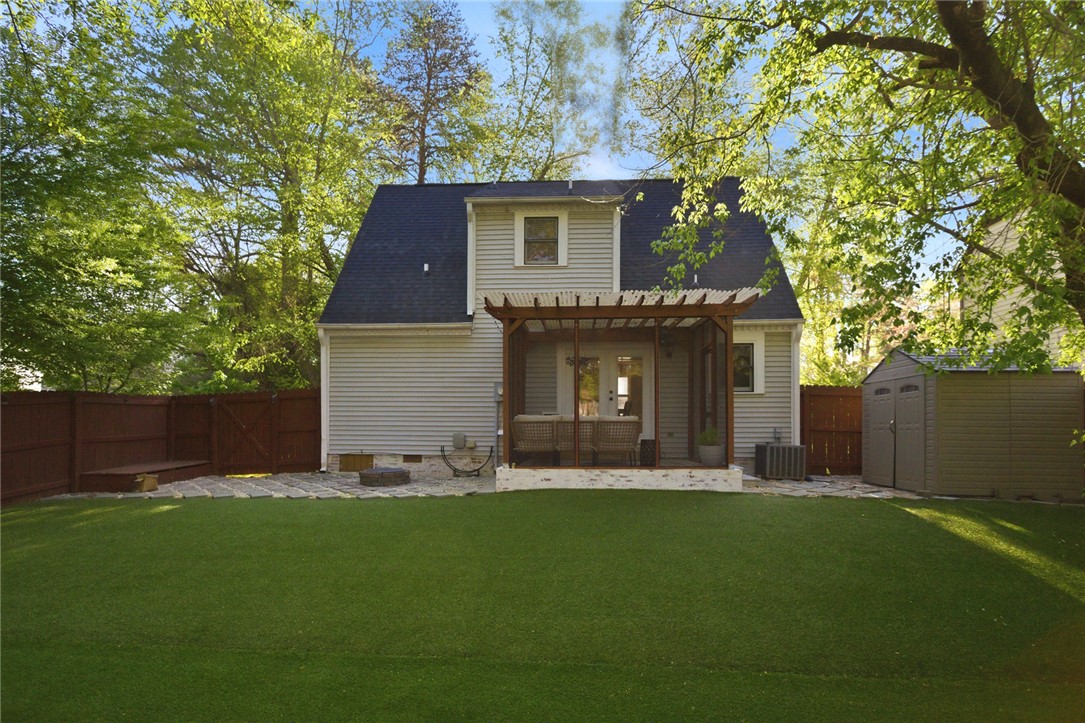 100 Henry Court Central, SC 29630 - Photo 32 of 39 This outdoor oasis features a covered patio and lush green lawn, perfect for relaxation and recreation.