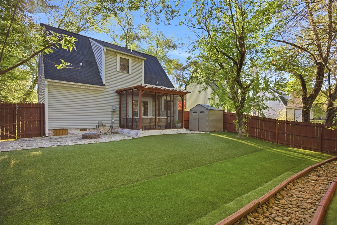 100 Henry Court Central, SC 29630 - Photo 33 of 39 This private yard offers a spacious lawn, a charming screened patio, and convenient storage.