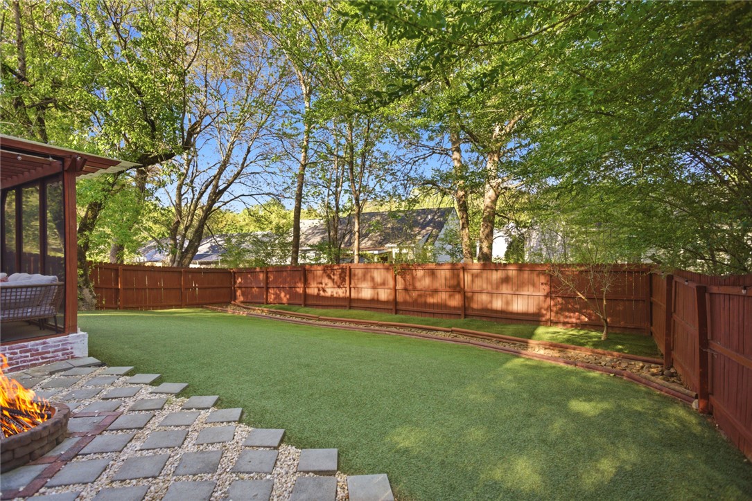 100 Henry Court Central, SC 29630 - Photo 36 of 39 This tranquil backyard sanctuary features lush turf, a private fire pit, and a screened porch.