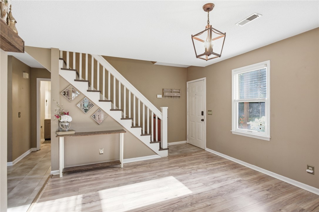 100 Henry Court Central, SC 29630 - Photo 4 of 39 This living area features ample natural light and direct access to the inviting staircase.