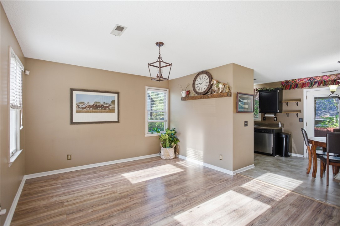 100 Henry Court Central, SC 29630 - Photo 5 of 39 This bright living space features durable flooring and an open flow to the adjacent kitchen.