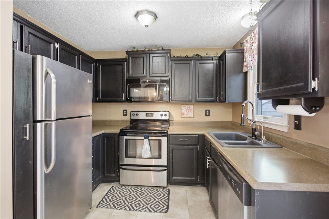 100 Henry Court Central, SC 29630 - Photo 8 of 39 This functional kitchen features ample cabinetry and modern appliances, perfect for daily living.