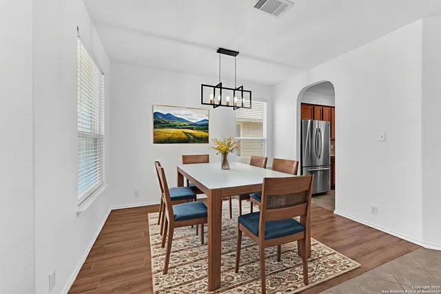 a bedroom with bed and a chandelier
