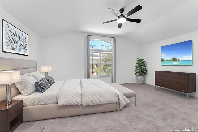 a view of empty room with ceiling fan