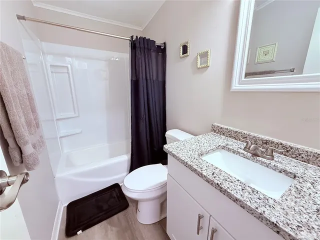 a view of a wooden deck with furniture