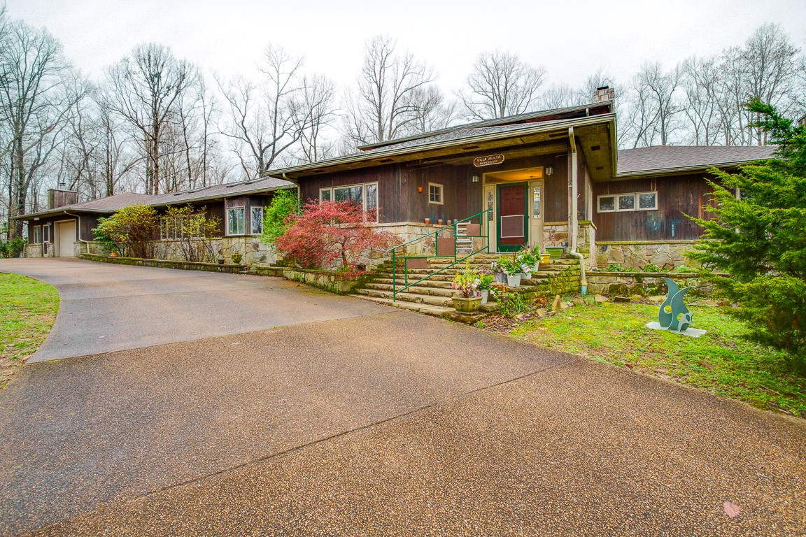 1033 Eva Lake Road Sewanee, TN 37375 - Photo 2 of 49 a front view of house with yard