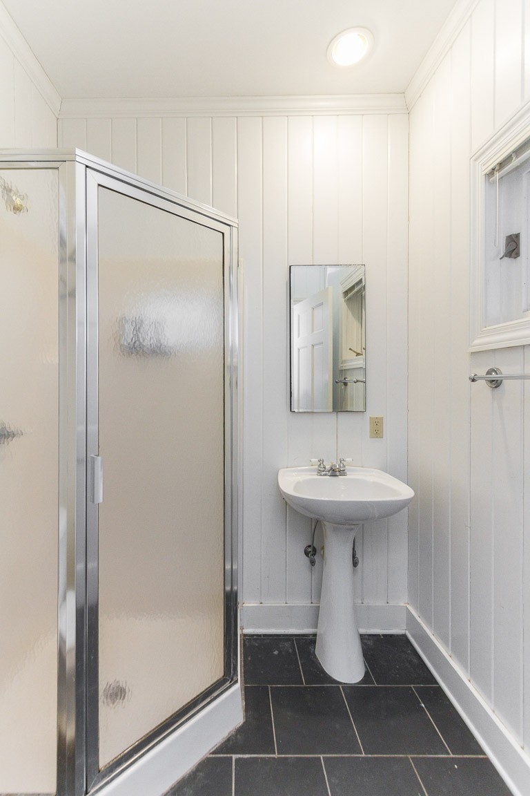1033 Eva Lake Road Sewanee, TN 37375 - Photo 19 of 49 a bathroom with a sink a toilet and shower