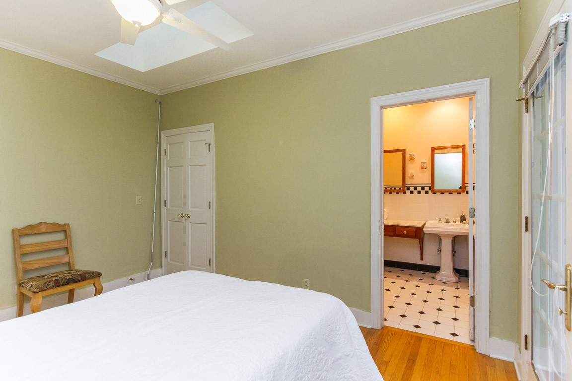 1033 Eva Lake Road Sewanee, TN 37375 - Photo 22 of 49 a bedroom with a bed and a view of bathroom