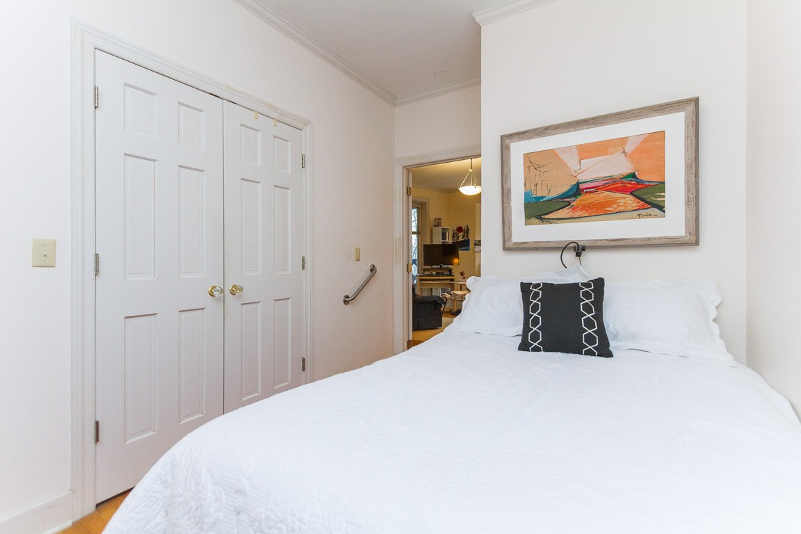 1033 Eva Lake Road Sewanee, TN 37375 - Photo 28 of 49 a bedroom with a bed and wall painting